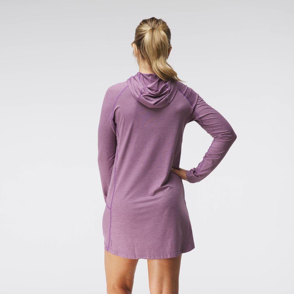 An individual wears an NRS Silkweight Hoodie Dress, crafted from recycled materials, posing with their back to the camera against a crisp white background.