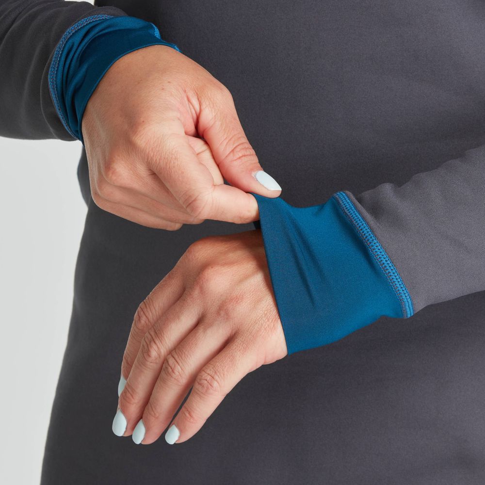 A person adjusts the blue cuff of an NRS Expedition Fleece - Women's gray sleeve, crafted from recycled material, displaying fingers with light blue nail polish.