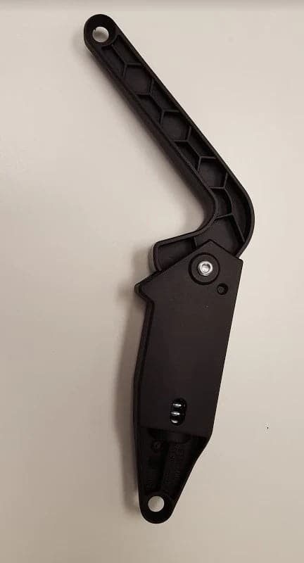 A Yakima Skybox Lid Support #1 Replacement handle on a white surface.