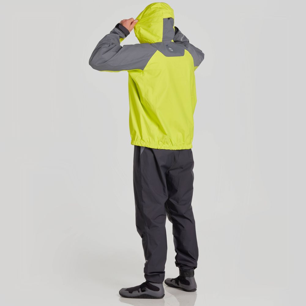 A person wearing the NRS High Tide Jacket in yellow and gray faces away while adjusting the adjustable hood for enhanced paddling protection.