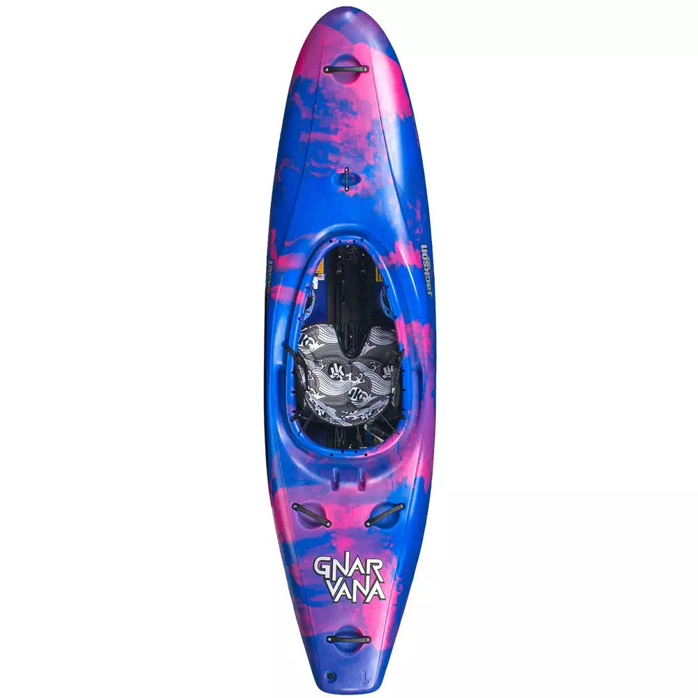 A Gnarvana kayak with a pink and blue design by Jackson Kayak.