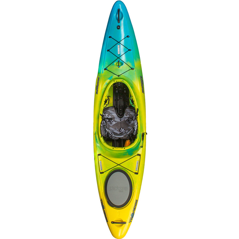 A yellow and blue Karma Traverse kayak by Jackson Kayak on a white background.