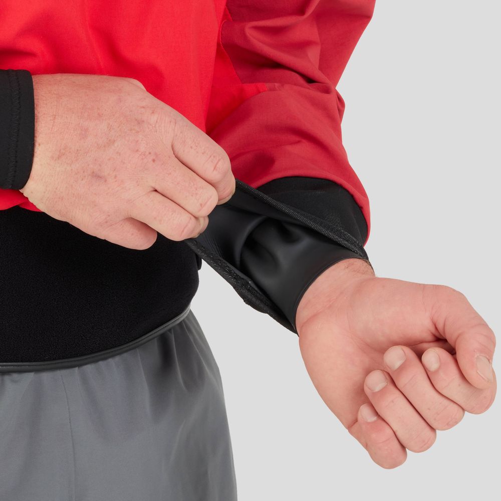 Person adjusting the cuff of a red NRS REV (GORE-TEX Pro) Drytop, featuring a black interior lining and designed for optimal paddling performance.