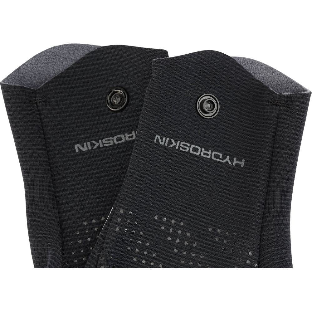 Close-up of two black Hydroskin 0.5mm Gloves by NRS, showing the word "HYDROSKIN" in white, snap buttons, a neoprene core, and textured grips.