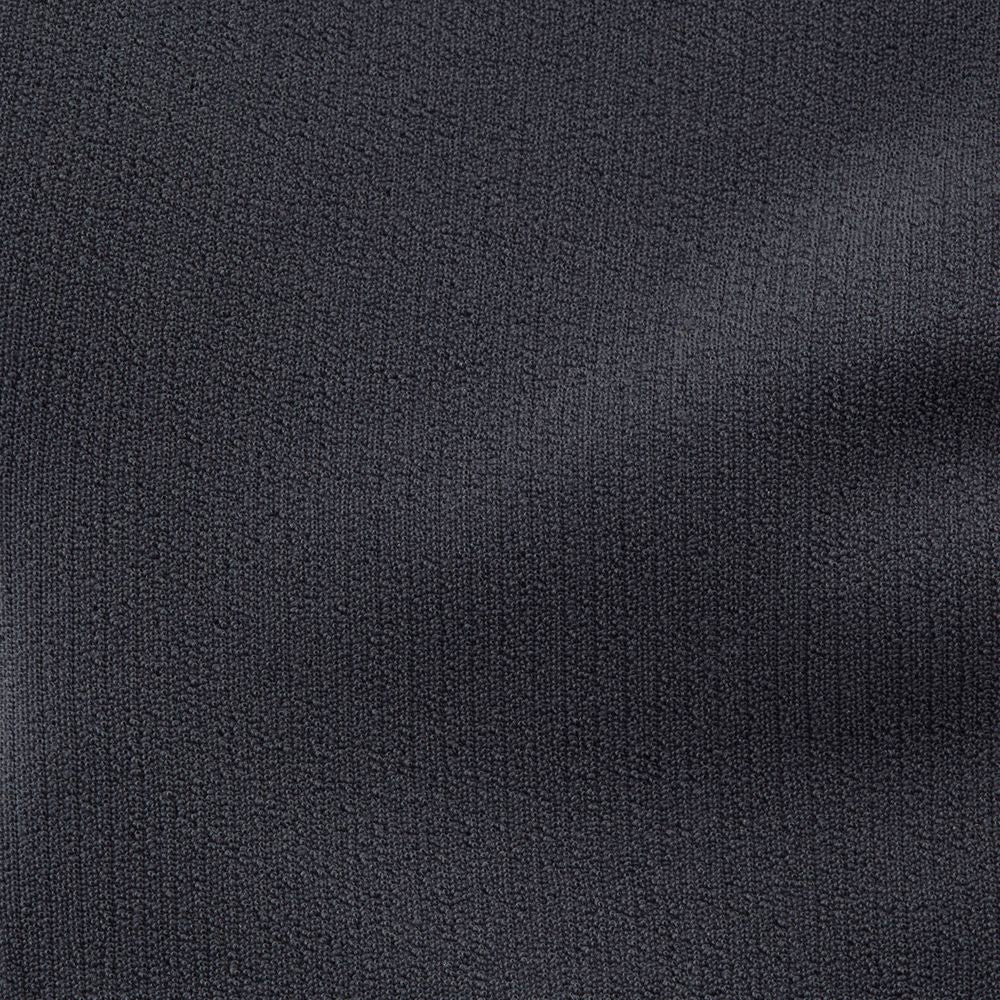 A close-up of a textured, dark gray fabric with a subtle, irregular pattern, reminiscent of the NRS Hydroskin 0.5mm Socks' neoprene core.