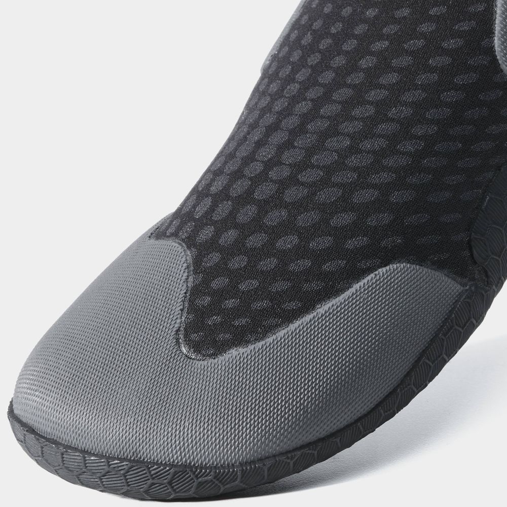 Close-up view of the Freestyle WetShoe by NRS, featuring a striking black and gray design crafted with Terraprene neoprene and a sleek rubber sole.