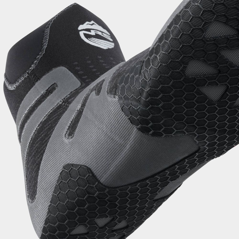 Close-up of black and gray textured fabric with a honeycomb pattern and mountain imagery on a curved surface. This might feature the NRS Freestyle WetShoe, known for its Terraprene neoprene build and minimalist rubber sole, perfect for sportswear or gear.