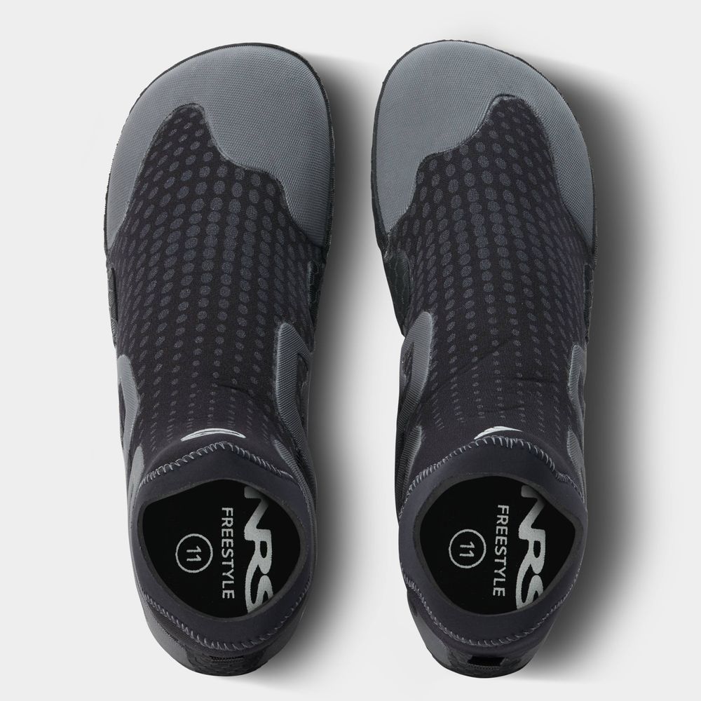 A top-down view of NRS Freestyle WetShoe water shoes in black and gray with dotted patterns shows the minimalist rubber sole for comfort, and the inner sole labeled "NRG Freestyle 11.