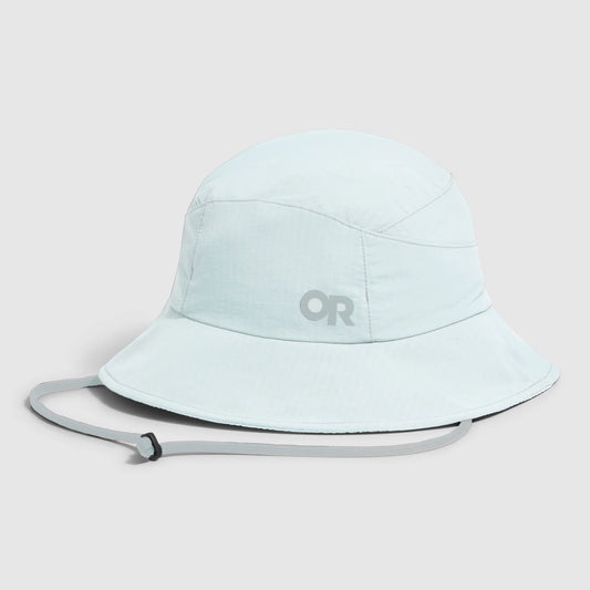 The Outdoor Research Sun Bucket Hat in light blue features a wide brim, adjustable chin strap, and an "OR" logo on the front, shown against a plain white background.