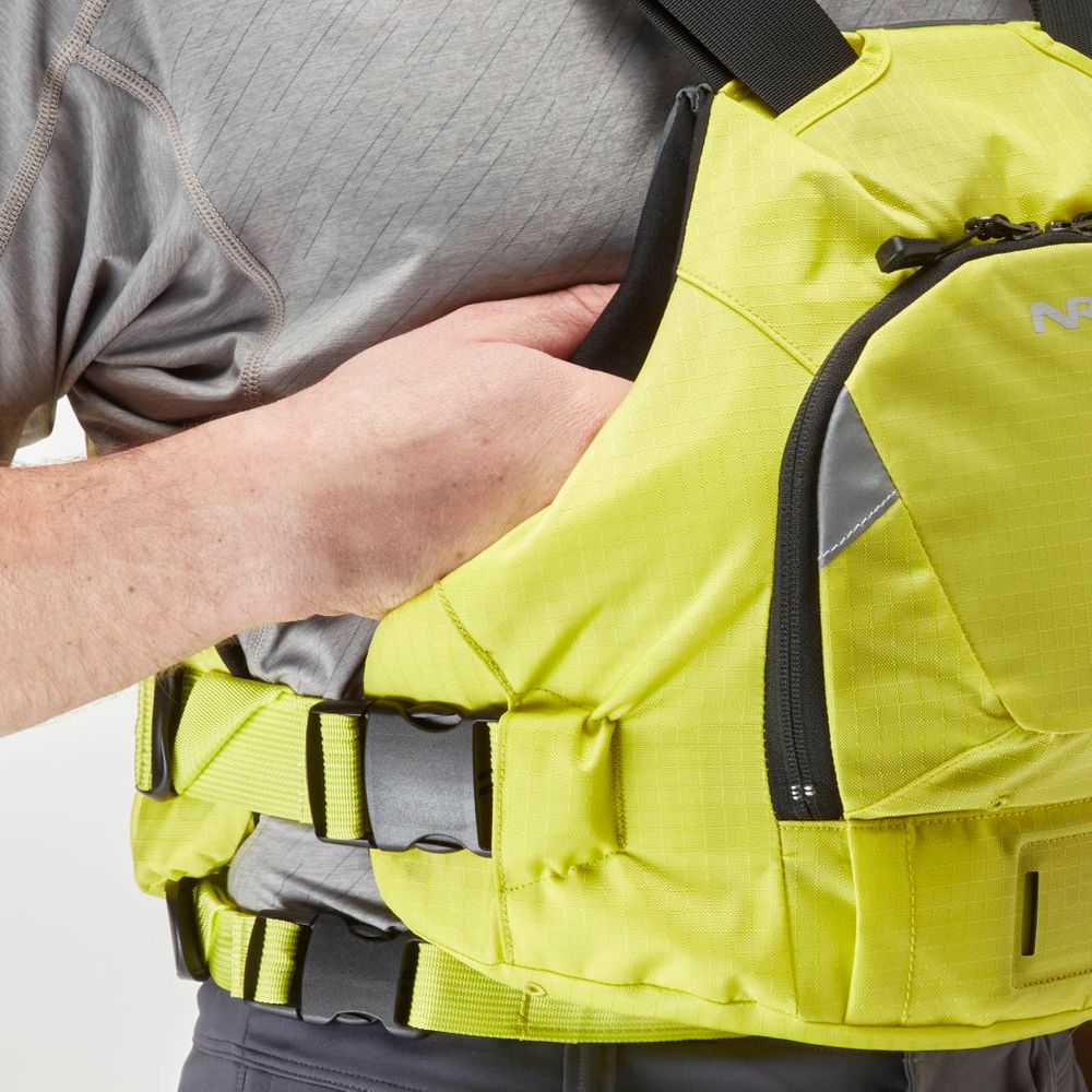 A person adjusts an NRS Ninja PFD in yellow, which has adjustable straps and a front zipper pocket for optimal flotation.