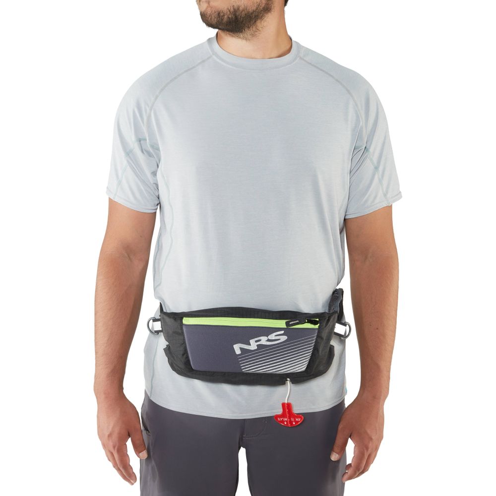 Wearing a gray shirt and shorts with an NRS Zephyr Inflatable PFD waist pack in black and gray, featuring a red pull tab, ideal for paddleboarding adventures.