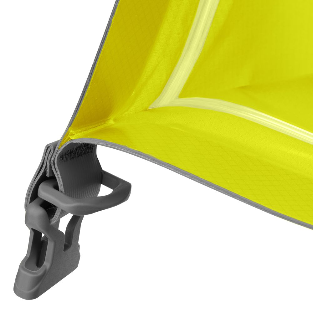 Close-up of a yellow fabric with a gray buckle and strap, highlighting the corner construction and stitching details typical of the durable NRS Comprehensive Medical Kit.