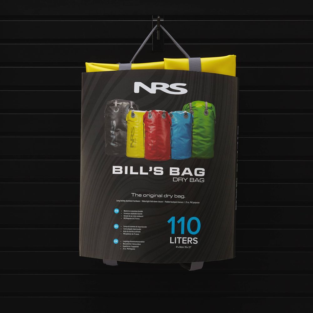 Showcase packaging for the NRS Bill's Bag—a 110-liter dry bag with backpack straps. Available in black, red, blue, and green.