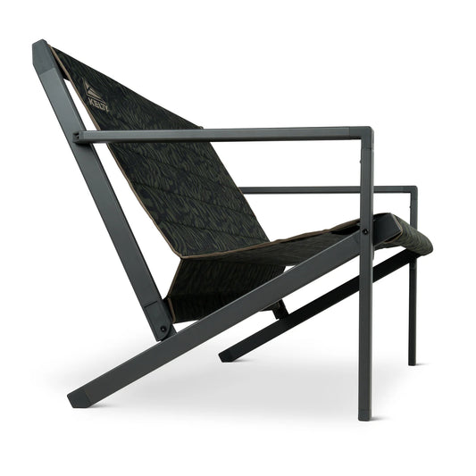 The Kelty Rad Loveseat is a modern two-person outdoor chair with a black metal frame and dark-patterned fabric, shown from a low side angle against a white background.
