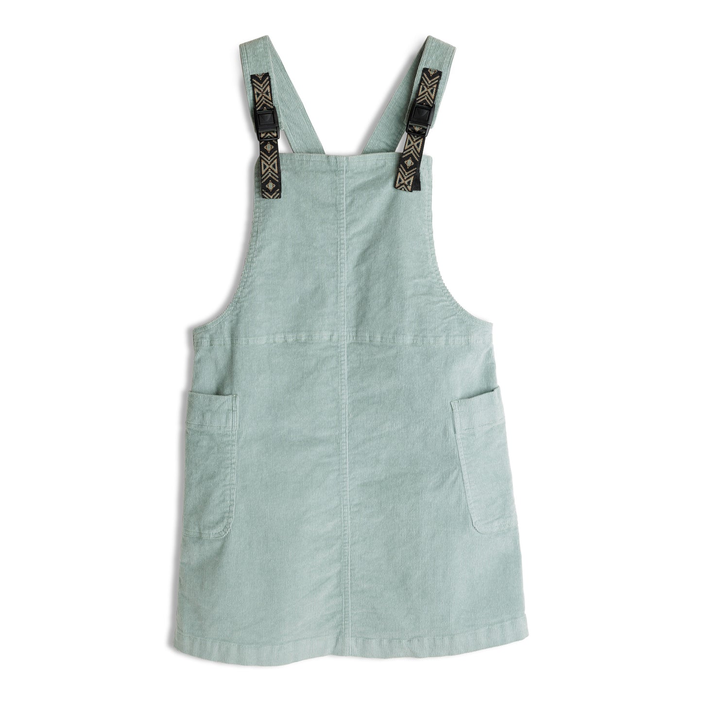 The Kavu June Jumper is a light green corduroy overall dress with two front pockets and adjustable black geometric-patterned straps.
