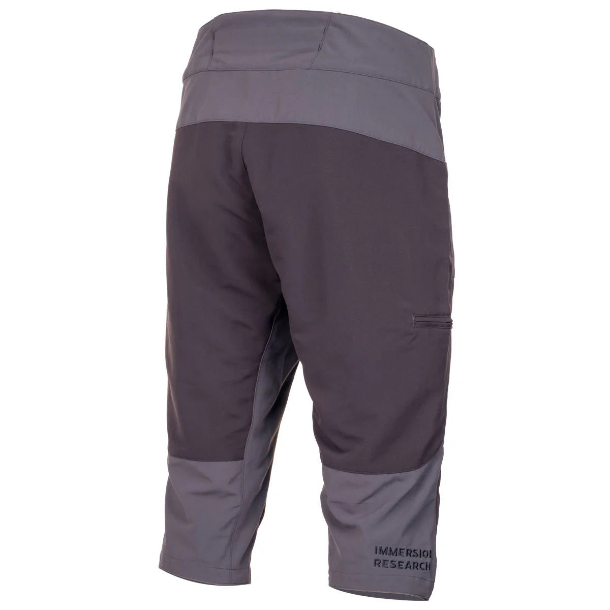 The Immersion Research Shinzer Shorts are gray, knee-length waterproof shorts made of durable nylon taslan with reinforced, abrasion-resistant panels and a small "Immersion Research" logo near the left leg hem.