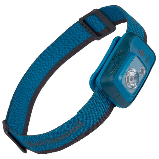 The Black Diamond Cosmo 350R Rechargeable Headlamp is a blue waterproof light with an adjustable elastic strap, rectangular unit with buttons, night vision mode, and the Black Diamond logo.