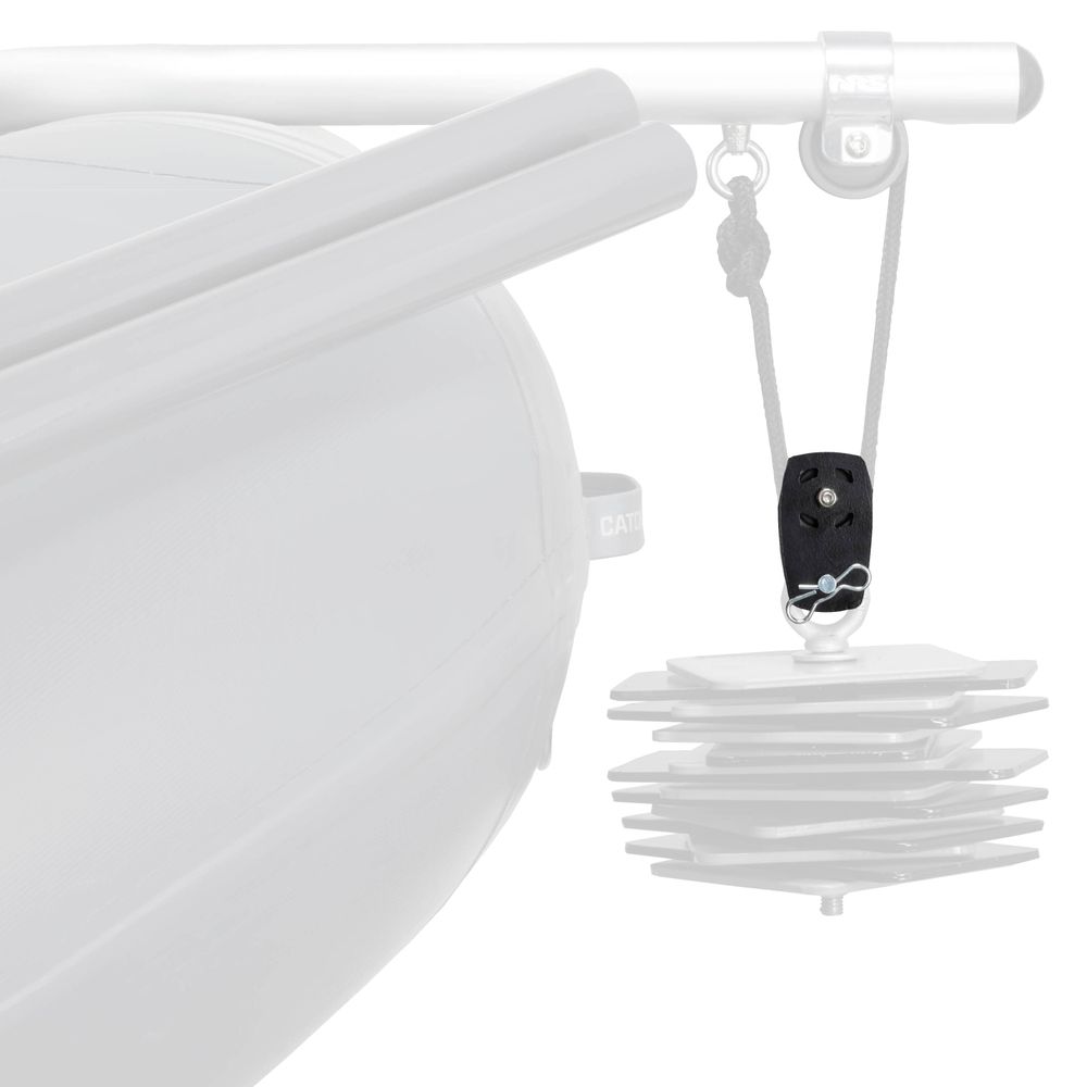 A black NRS Anchor Pulley is mounted on a rope, suspending stacked square metal plates under a rail on a boat to deliver mechanical advantage.