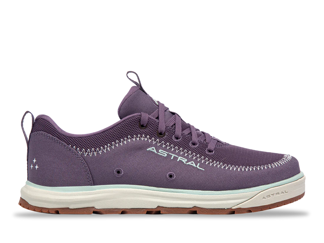 The Brewer 3.0 by Astral is a purple casual sneaker made from hydrophobic canvas, ideal for kayakers. It boasts white stitched details, a white sole, a heel loop, and proudly displays the brand name "ASTRAL" on the side.