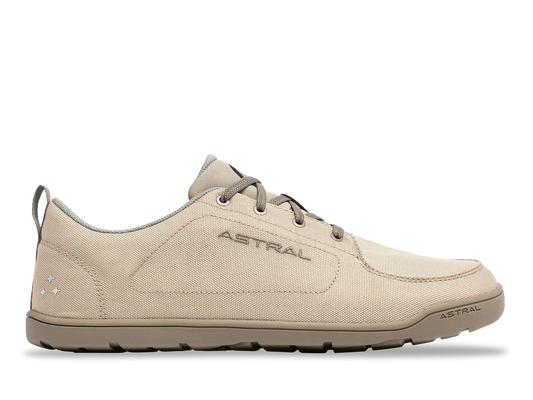 The Astral Loyak All Weather is a beige low-top sneaker with a lace-up closure and "ASTRAL" branding, made from recycled polyester canvas for sustainability, shown on a white background.