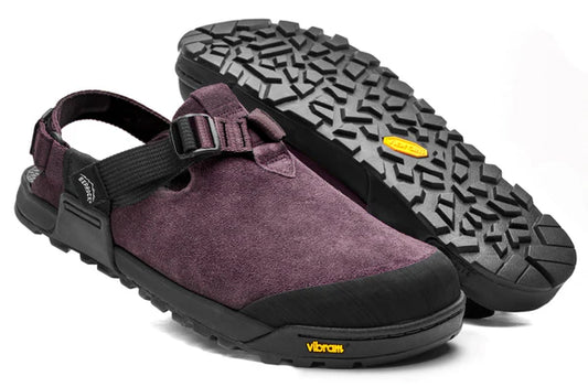 The Bedrock Mountain Clog is a pair of maroon suede sandals with black Vibram soles, adjustable heel straps, and a buckle, shown from the side and bottom views.
