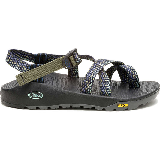 The Chaco Z2 Rapid Pro men's adventure sandal features adjustable webbing straps, a thick black sole, and a Vibram outsole, shown in side profile against a white background.