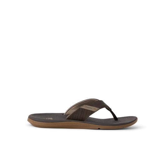 The REEF SANTA ANA sandal in brown features a textured footbed and sole for water-friendly comfort and style, shown against a plain white background.
