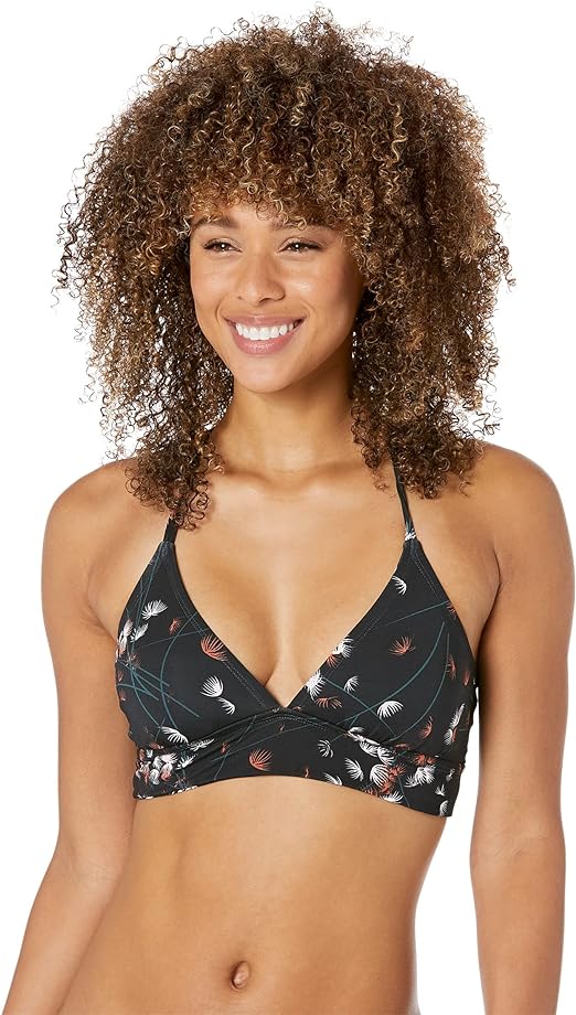 A woman wearing a Carve Dahlia Top bikini top.