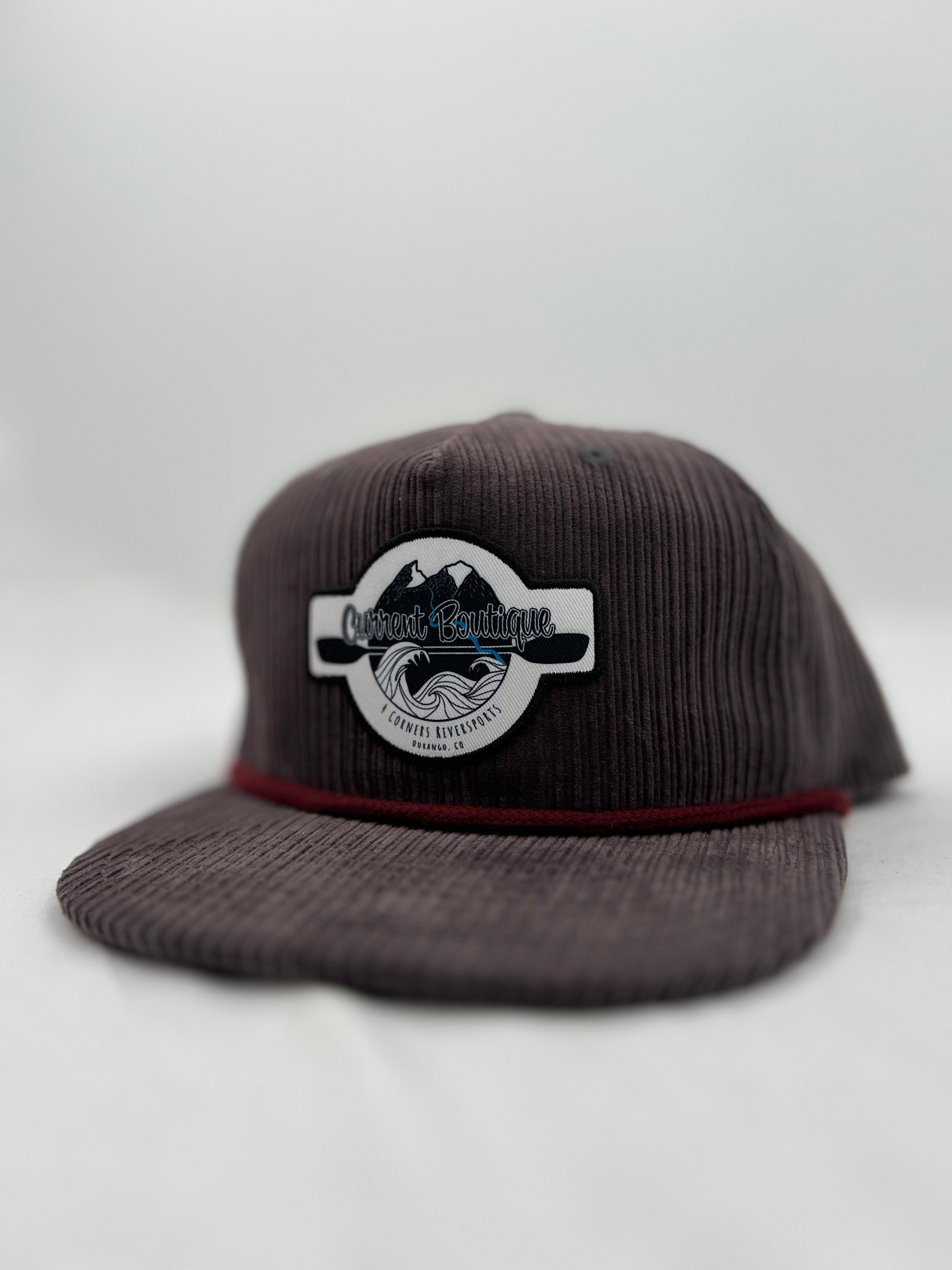A brown corduroy snapback hat with an embroidered Captuer Headwear logo patch.