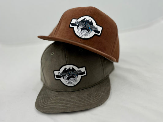 A Current Boutique Cord hat with a patch on it.