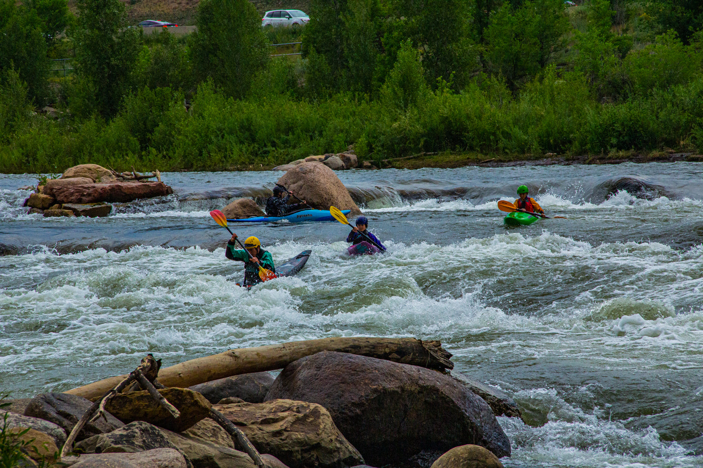 4CRS Paddle School kayaking in a Grom Squad: Advanced River Running.