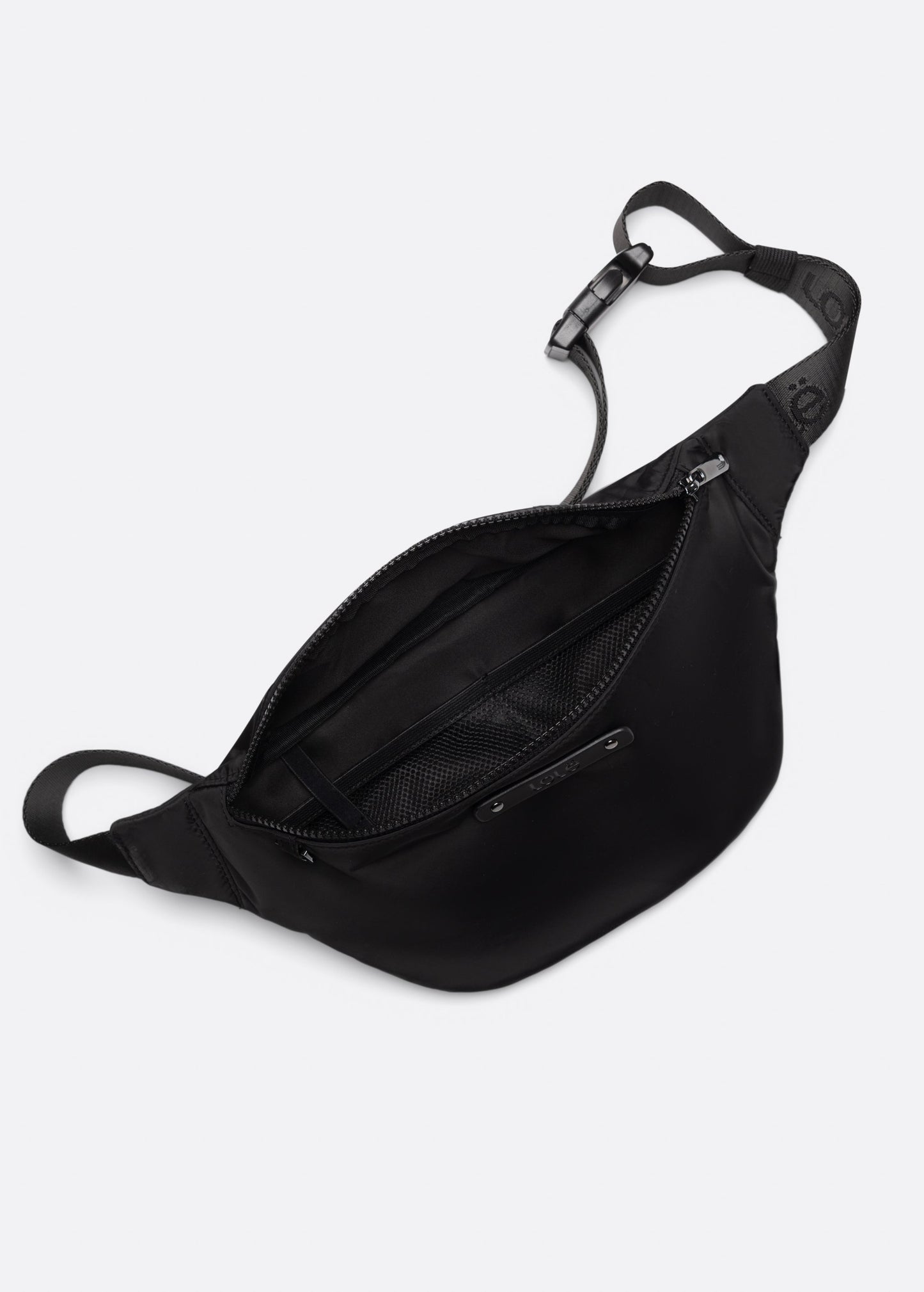 The Lole Taylor Belt Bag features an adjustable strap and zippered closure, shown open to display its inner mesh pocket and roomy main compartment with a secure zip pocket, all set against a white background.