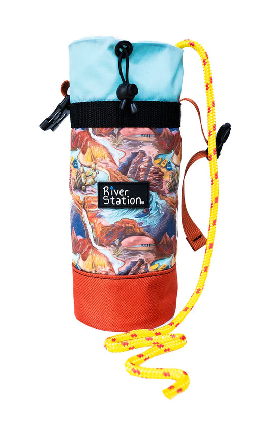 The Limited Edition Throw Bag - 60' by River Station Gear is a compact, high-quality bag with a colorful mountain design, blue drawstring top, black closure, and yellow climbing rope.