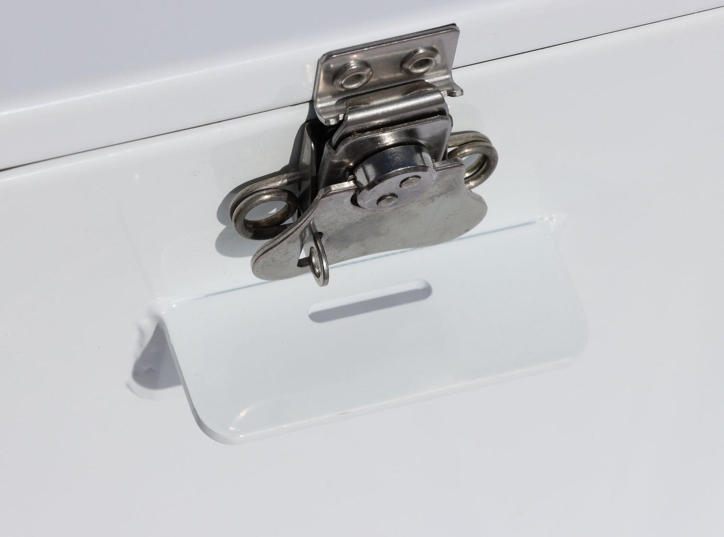 A close up of a Rio Craft Powder-Coated Aluminum Drybox lock on a white door featuring maximum security.