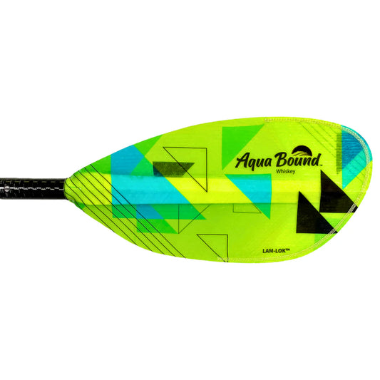 A close-up of the neon green AquaBound Whiskey 4-Piece Paddle blade, featuring geometric blue and black designs and branding, made from fiberglass and designed for high-angle paddling.