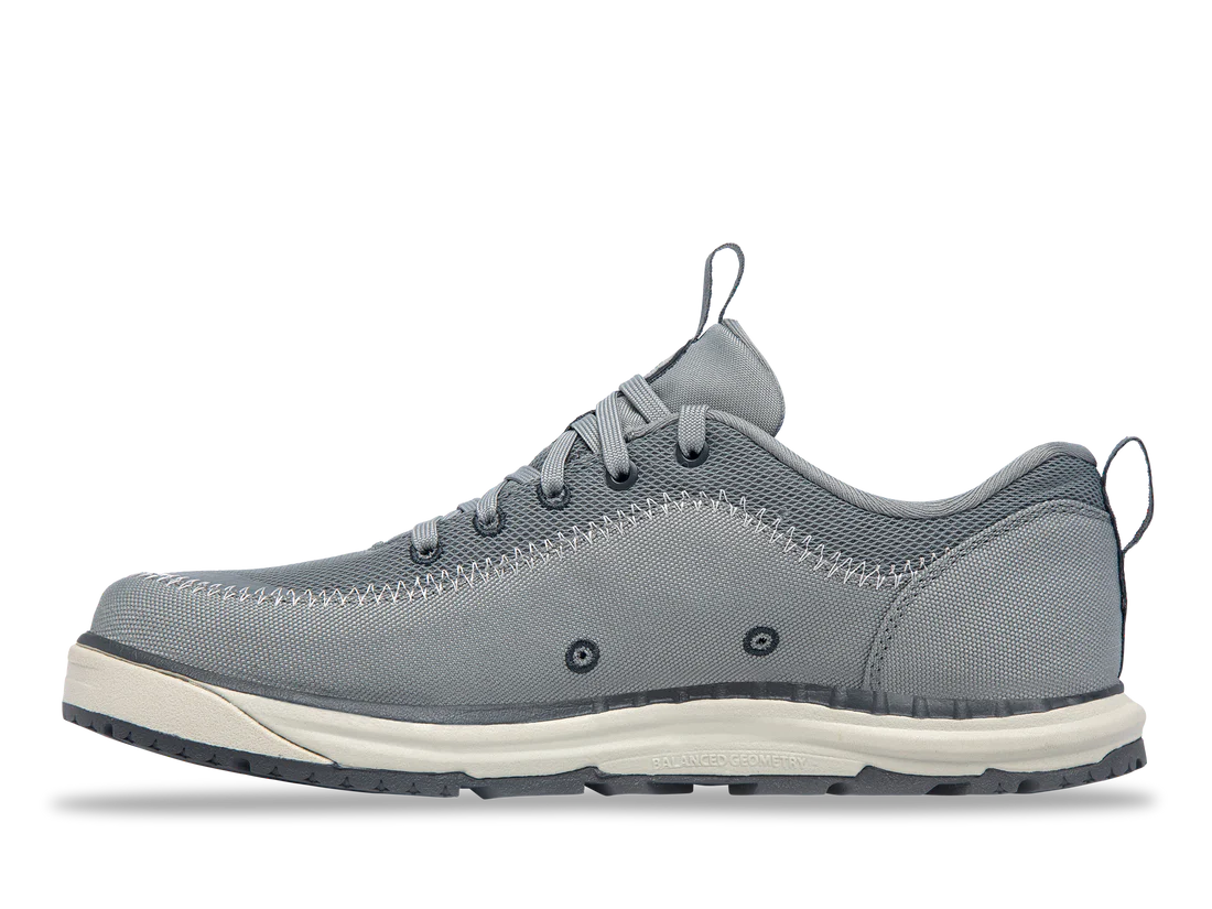 The Astral Brewer 3.0 offers a stylish gray sneaker with hydrophobic canvas, white and blue outsole, detailed stitching, and metal eyelets—perfect for kayakers seeking functionality and style.