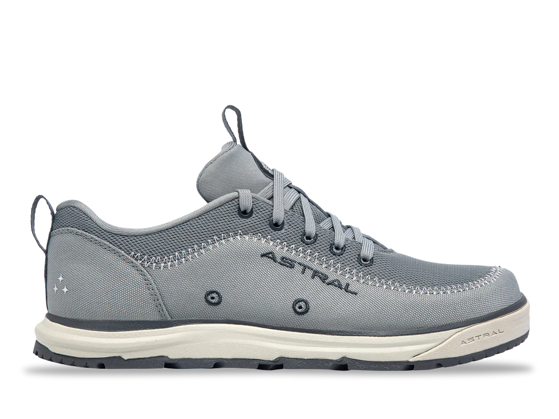 Astral's Brewer 3.0 is a gray casual water shoe for kayakers, featuring laces, a mesh upper, hydrophobic canvas, and a white sole, with the brand's name visible on the side.