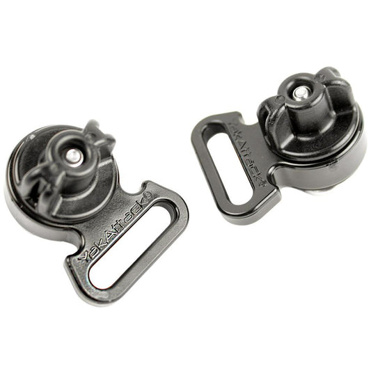 A pair of YakAttack Horizontal Tie Downs, black and designed for kayak track systems, are shown against a white background. They feature slotted points and rotating knobs, ideal for bungee attachments.