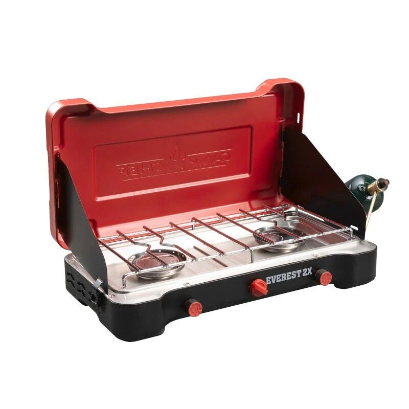 The Everest 2X Camp Stove by Camp Chef is a red and black camp stove with two burners, perfect for outdoor cooking.