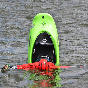 a person in a kayak in the water.