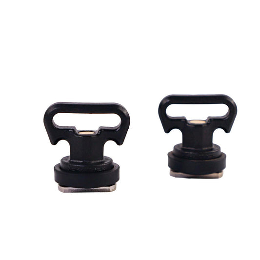 Two YakAttack Vertical Tie Down pairs, featuring black plastic and metal construction with T-shaped handles in two sizes, compatible with GearTrac kayak track systems, are displayed on a white background.