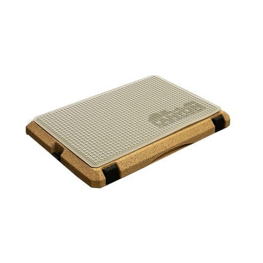 The Cooler Aquatraction Pads by Canyon Coolers feature a rectangular design with a textured beige surface, durable cork base, sturdy black corners, and an EVA foam layer for enhanced grip and comfort.