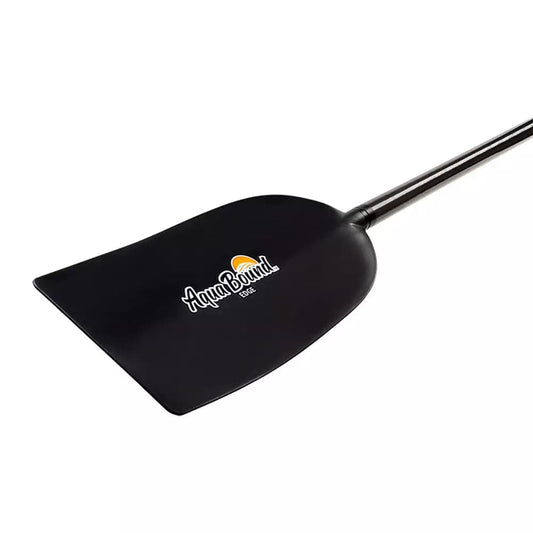 The AquaBound Edge Raft / Canoe Paddle features a black blade with the AquaBound logo and yellow sun graphic, plus a carbon shaft and T grip—ideal for whitewater canoeing, shown here against a white background.