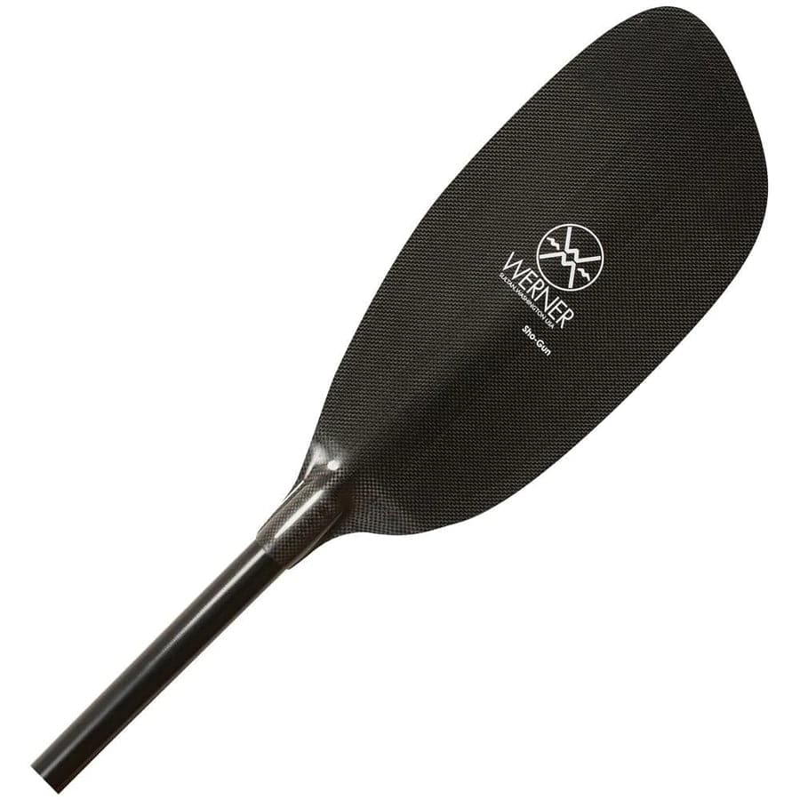 The Sho-Gun by Werner Paddles, ideal for whitewater adventures, boasts a sleek black design with a carbon fiber blade, distinctive "Werner" logo, and advanced carbon foam-core technology.