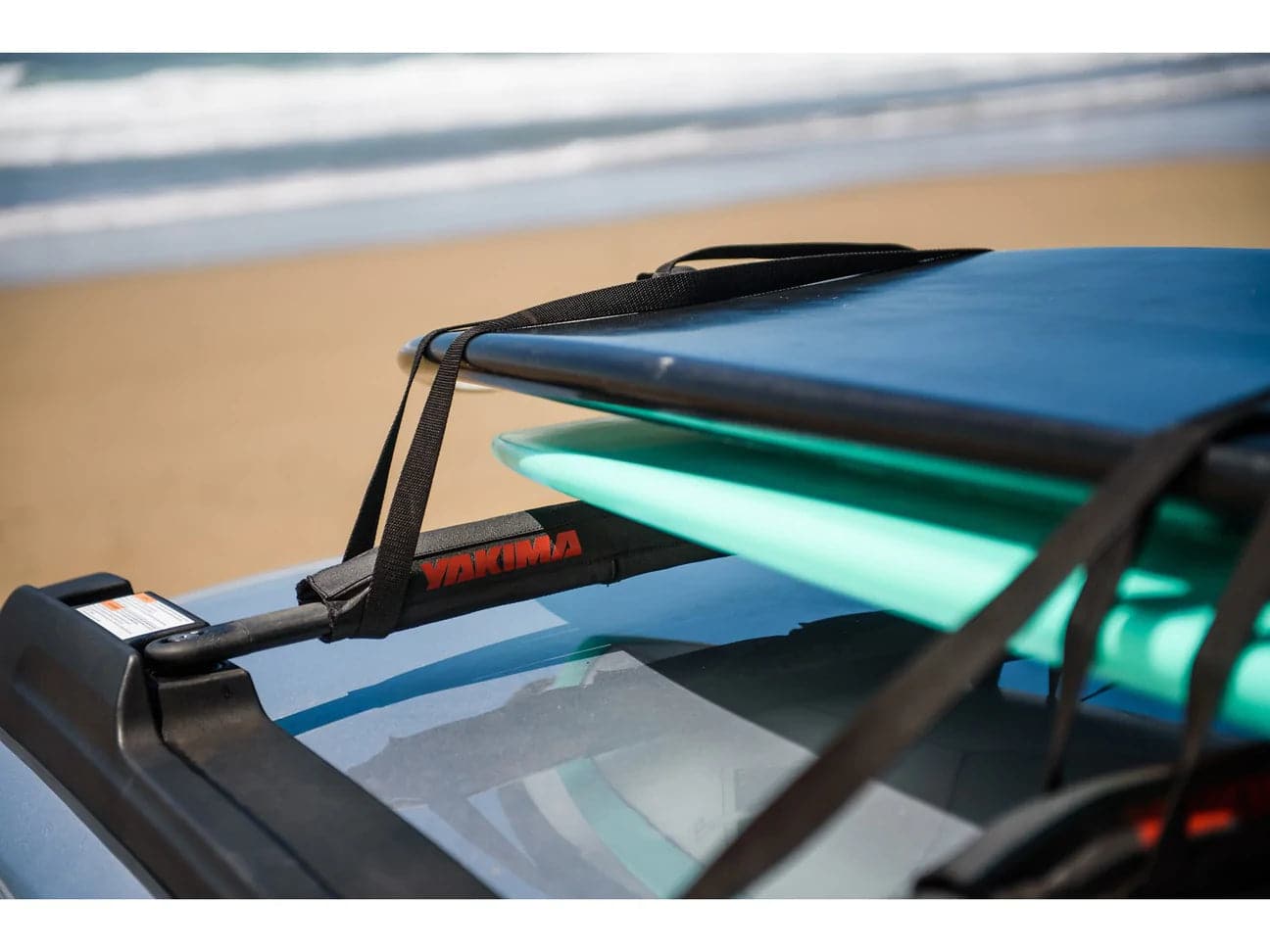 Featuring the 30 inch Aero Crossbar Pad bike mount, fishing accessory, rec kayak accessory, snow mount, tour kayak accessory, transport manufactured by Yakima shown here from a fifth angle.