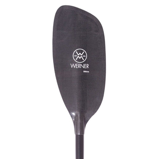 Close-up of a black Stikine paddle blade with "Werner Paddles" logo in white. Made with Kevlar for durability, this paddle is ideal for whitewater, and its textured surface provides a firm grip.