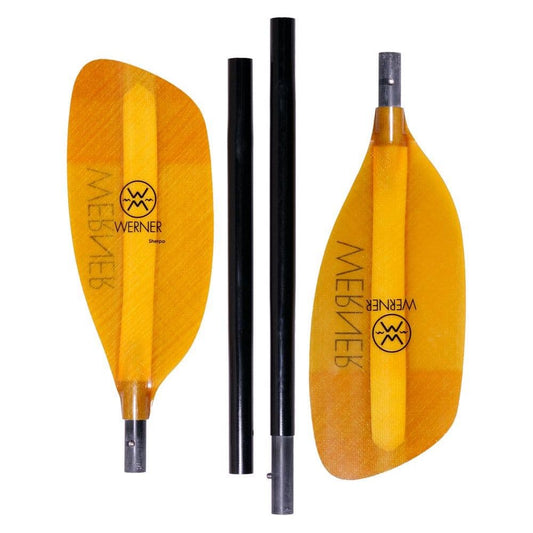 On a white background, the yellow Werner Paddles 'Sherpa 4-Piece' kayak paddle disassembles into four parts, with two orange blades and two black shafts showcasing a river running design and clear brand markings.
