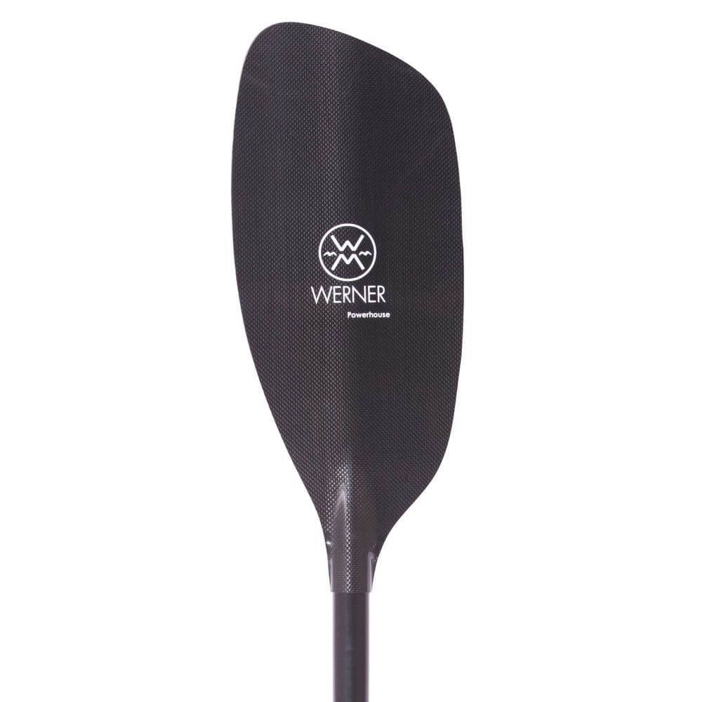 Close-up of a Werner Paddles Powerhouse Carbon kayak paddle blade, showcasing its sleek black carbon fiber surface with the white brand logo and name—ideal for river running adventures.