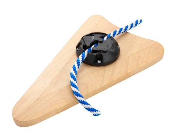 The Harmony Gear Cam Cleat features a wooden wedge attached to a black plastic cam cleat and is threaded with a blue and white striped rope, ideal for securing anchors on canoe decks.
