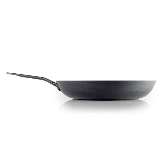 Side view of the corrosion-resistant, lightweight Guidecast Frying Pan by GSI Outdoors, featuring a long handle on a white background, ideal for gourmet cooking.